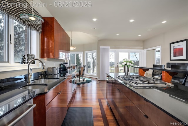 5007 Rockaway Ln, Clarkston, MI 48348 - kitchen featuring modern cabinets, stainless steel gas cooktop, recessed lighting, brown cabinetry, and dishwasher