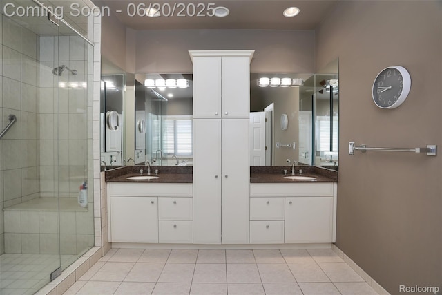 5007 Rockaway Ln, Clarkston, MI 48348 - bathroom featuring a stall shower, double vanity, and tile patterned floors
