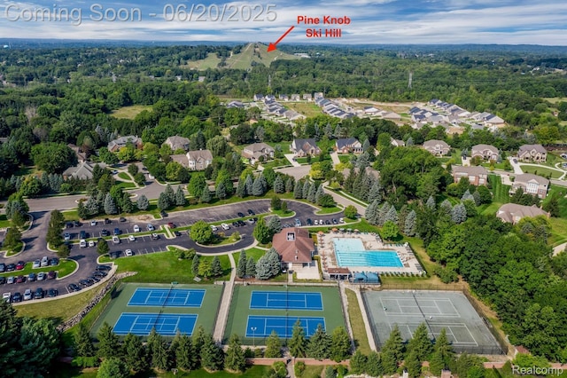 5007 Rockaway Ln, Clarkston, MI 48348 - aerial view of property's location featuring a pool and a heavily wooded area