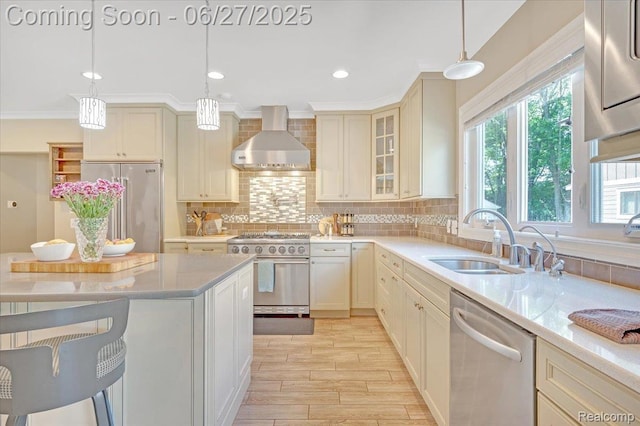 240 Red Oak Ln, Rochester Hills, MI 48307 - kitchen featuring high end appliances, wall chimney range hood, decorative backsplash, light wood-type flooring, and light countertops