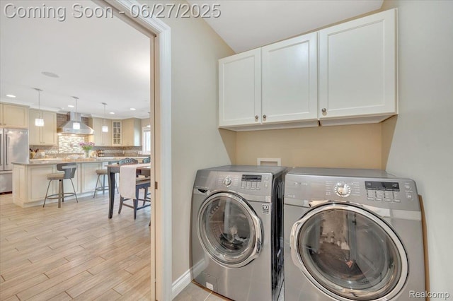240 Red Oak Ln, Rochester Hills, MI 48307 - laundry area with cabinet space, separate washer and dryer, light wood-style floors, and recessed lighting
