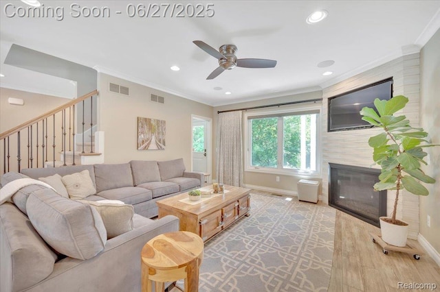 240 Red Oak Ln, Rochester Hills, MI 48307 - living area featuring a glass covered fireplace, crown molding, ceiling fan, wood finished floors, and recessed lighting