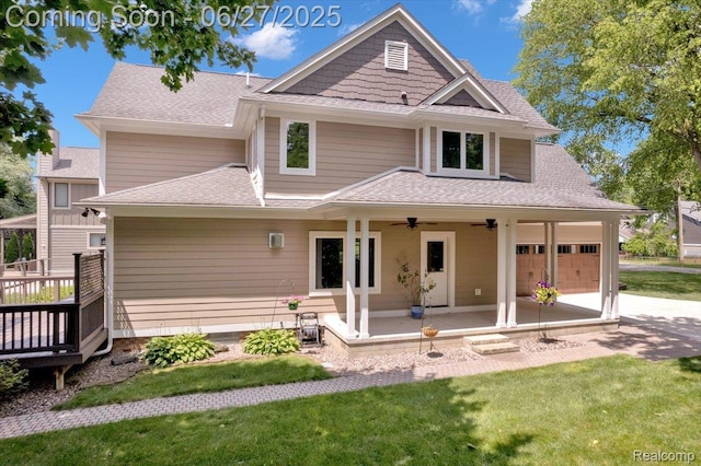 240 Red Oak Ln, Rochester Hills, MI 48307 - back of house with a lawn, a ceiling fan, a garage, and a shingled roof