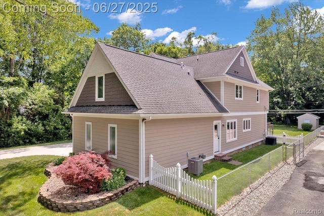 240 Red Oak Ln, Rochester Hills, MI 48307 - view of side of home featuring a central AC unit and a shingled roof
