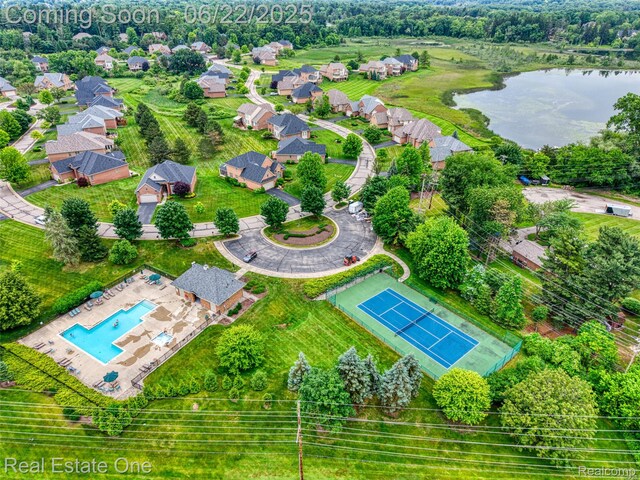 5258 Hidden Pines Dr, Brighton, MI 48116 - aerial view of residential area with a pool area and a nearby body of water