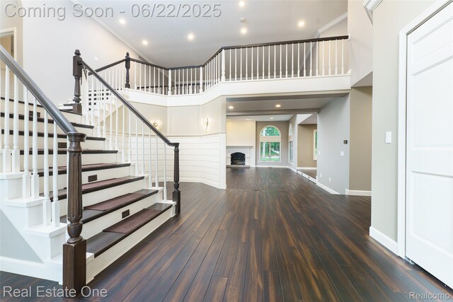 5258 Hidden Pines Dr, Brighton, MI 48116 - entryway with wood finished floors, stairway, a fireplace, and recessed lighting