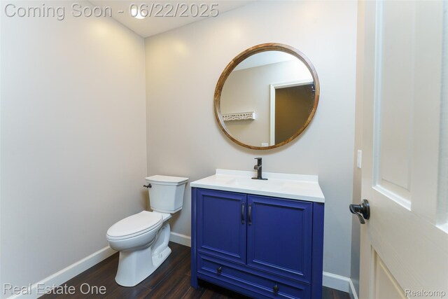 5258 Hidden Pines Dr, Brighton, MI 48116 - half bath featuring vanity and wood finished floors