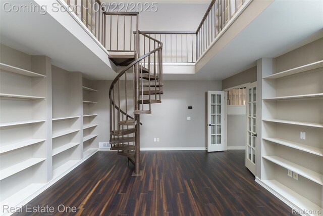 5258 Hidden Pines Dr, Brighton, MI 48116 - staircase with wood finished floors and french doors