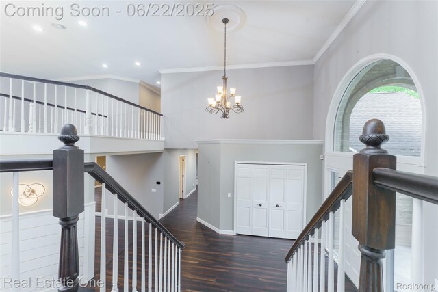 5258 Hidden Pines Dr, Brighton, MI 48116 - foyer featuring crown molding, wood finished floors, a chandelier, recessed lighting, and stairs