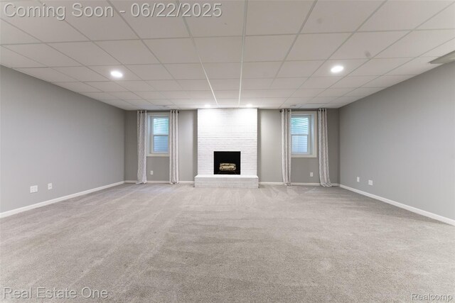 5258 Hidden Pines Dr, Brighton, MI 48116 - unfurnished living room with carpet floors, a fireplace, a paneled ceiling, and recessed lighting