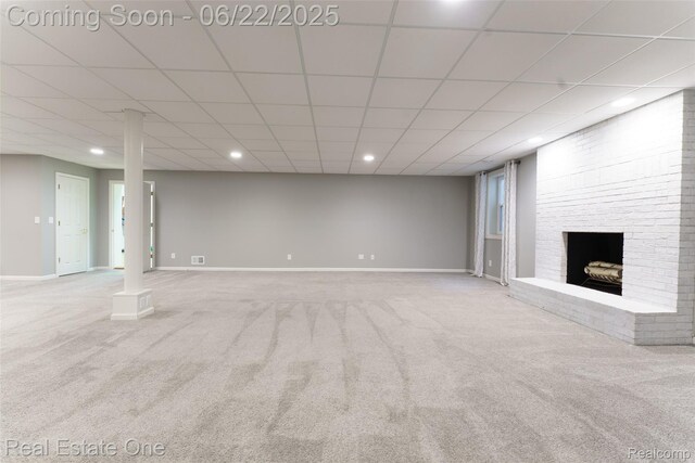 5258 Hidden Pines Dr, Brighton, MI 48116 - below grade area featuring carpet floors, recessed lighting, and a brick fireplace