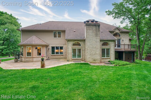 5258 Hidden Pines Dr, Brighton, MI 48116 - rear view of property featuring a patio, a lawn, and brick siding
