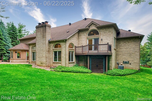 5258 Hidden Pines Dr, Brighton, MI 48116 - rear view of property with brick siding, a chimney, a lawn, a balcony, and roof with shingles