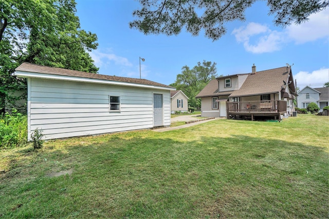 59 Dunning Ave, Battle Creek, MI 49037 - back of property featuring a wooden deck and a yard