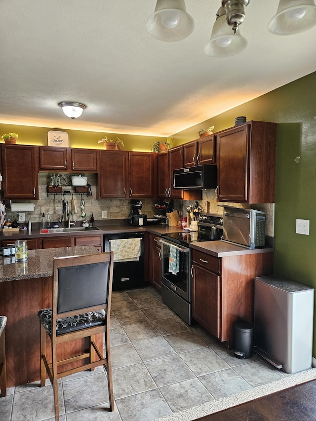 16304 Trent Ridge Dr, Cedar Springs, MI 49319 - kitchen featuring stainless steel electric stove, black microwave, tasteful backsplash, dark countertops, and dark brown cabinets