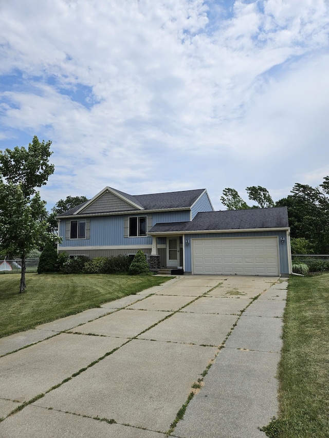 16304 Trent Ridge Dr, Cedar Springs, MI 49319 - split level home with concrete driveway, an attached garage, and a front yard