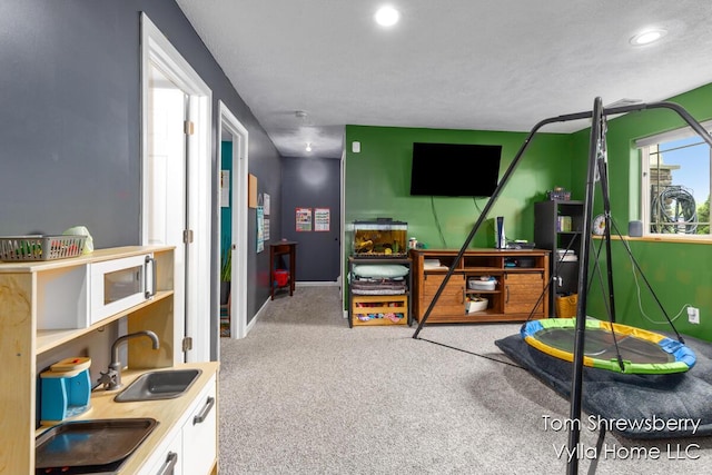 16304 Trent Ridge Dr, Cedar Springs, MI 49319 - recreation room with carpet and recessed lighting