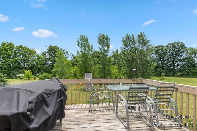 16304 Trent Ridge Dr, Cedar Springs, MI 49319 - wooden terrace with a grill, view of scattered trees, and a yard