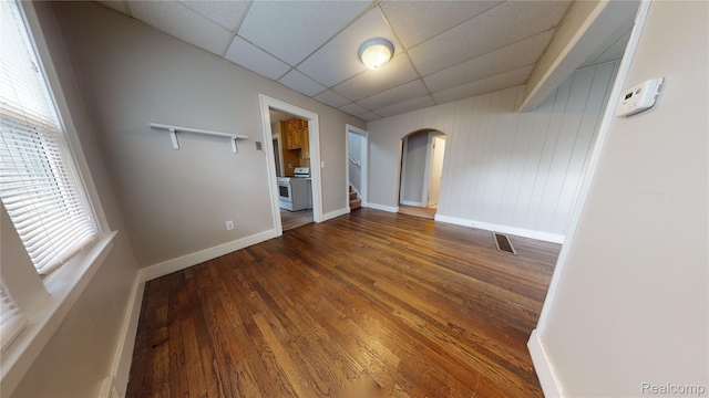 929 Kettering Ave, Pontiac, MI 48340 - unfurnished room with arched walkways, a drop ceiling, and wood finished floors