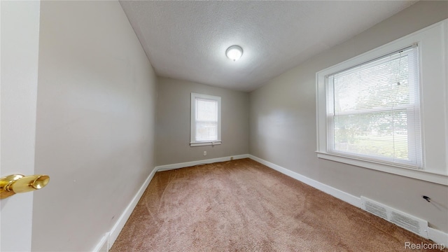 929 Kettering Ave, Pontiac, MI 48340 - unfurnished room featuring light carpet and a textured ceiling