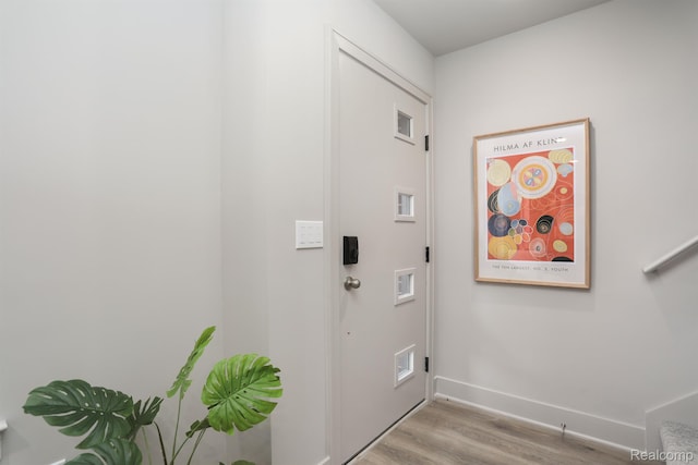 2133 Evergreen Ln Unit 28, Ann Arbor, MI 48103 - washroom with wood finished floors and baseboards