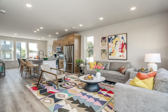 2133 Evergreen Ln Unit 28, Ann Arbor, MI 48103 - living room featuring plenty of natural light, recessed lighting, and light wood finished floors