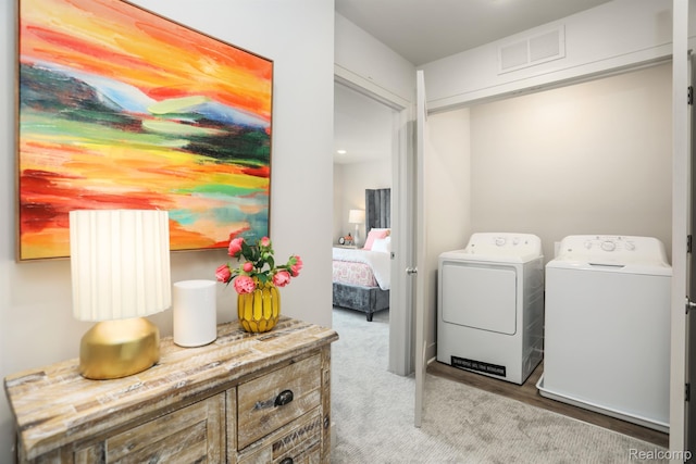 2133 Evergreen Ln Unit 28, Ann Arbor, MI 48103 - washroom with washing machine and clothes dryer and carpet flooring