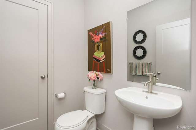 2133 Evergreen Ln Unit 28, Ann Arbor, MI 48103 - half bath featuring a sink and toilet