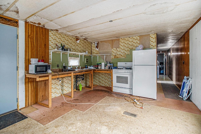 1715 S 48th Ave, Shelby, MI 49455 - kitchen with white appliances and wallpapered walls