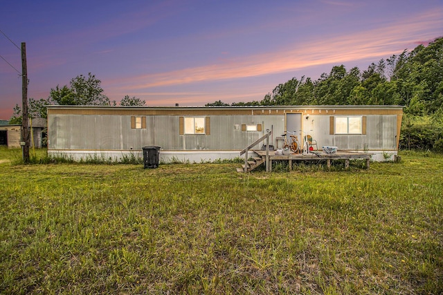 1715 S 48th Ave, Shelby, MI 49455 - back of property at dusk featuring a deck