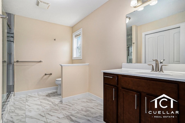 9365 Windward Dr, West Olive, MI 49460 - full bath featuring marble look tile flooring, vanity, and a shower with shower door