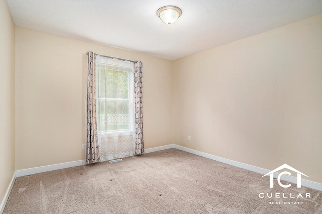 9365 Windward Dr, West Olive, MI 49460 - spare room with carpet