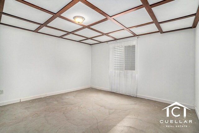 9365 Windward Dr, West Olive, MI 49460 - empty room with coffered ceiling and concrete flooring