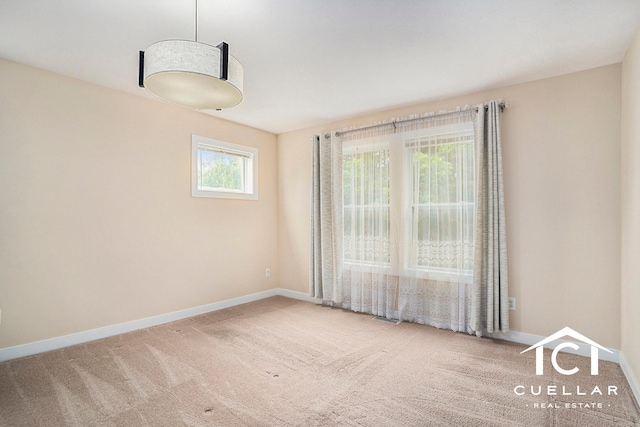 9365 Windward Dr, West Olive, MI 49460 - carpeted spare room featuring baseboards