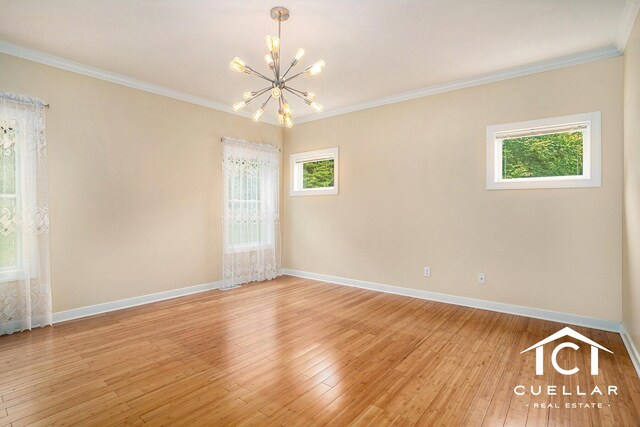 9365 Windward Dr, West Olive, MI 49460 - empty room with a chandelier, light wood finished floors, and crown molding