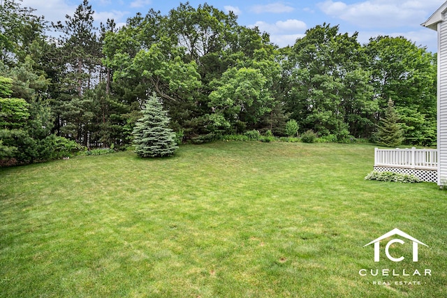 9365 Windward Dr, West Olive, MI 49460 - view of grassy yard featuring a wooden deck