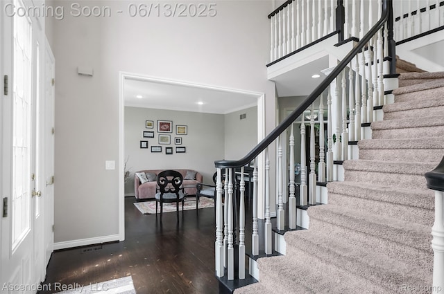 48392 Binghampton Dr, Northville, MI 48168 - foyer entrance featuring stairway, wood finished floors, a towering ceiling, ornamental molding, and recessed lighting