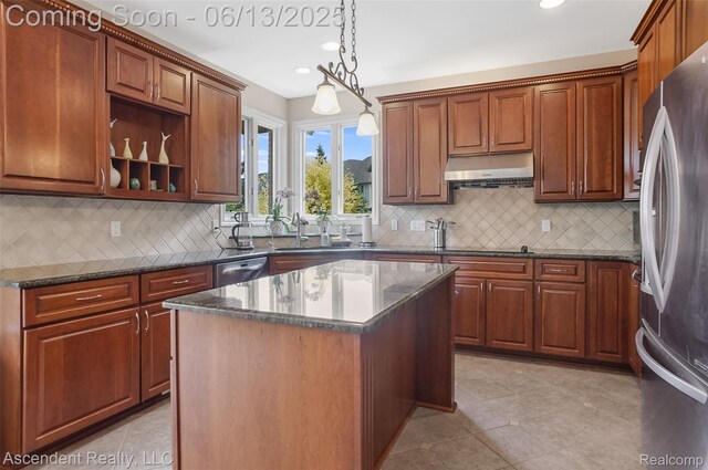 48392 Binghampton Dr, Northville, MI 48168 - kitchen featuring appliances with stainless steel finishes, under cabinet range hood, recessed lighting, pendant lighting, and backsplash