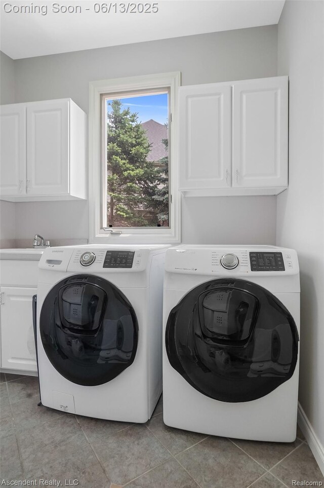 48392 Binghampton Dr, Northville, MI 48168 - washroom featuring cabinet space, separate washer and dryer, and light tile patterned floors
