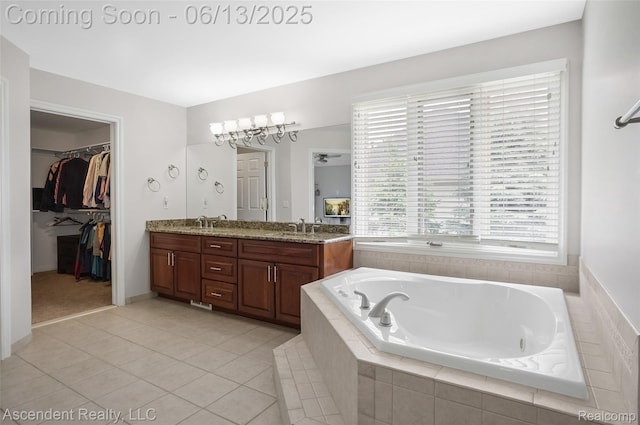 48392 Binghampton Dr, Northville, MI 48168 - bathroom featuring double vanity, a garden tub, tile patterned flooring, and a spacious closet