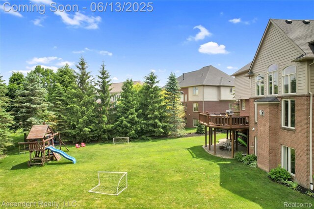 48392 Binghampton Dr, Northville, MI 48168 - view of yard with a deck, a sport area, and a playground