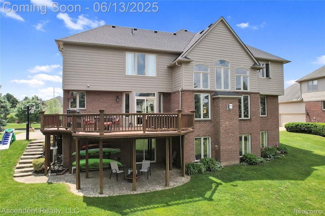 48392 Binghampton Dr, Northville, MI 48168 - rear view of house featuring a patio, brick siding, a lawn, and a wooden deck