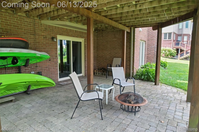 48392 Binghampton Dr, Northville, MI 48168 - view of patio / terrace with an outdoor fire pit