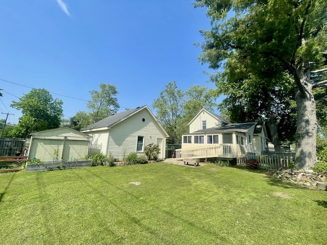 408 Wilkinson St, Chelsea, MI 48118 - rear view of house with a wooden deck and an outdoor structure