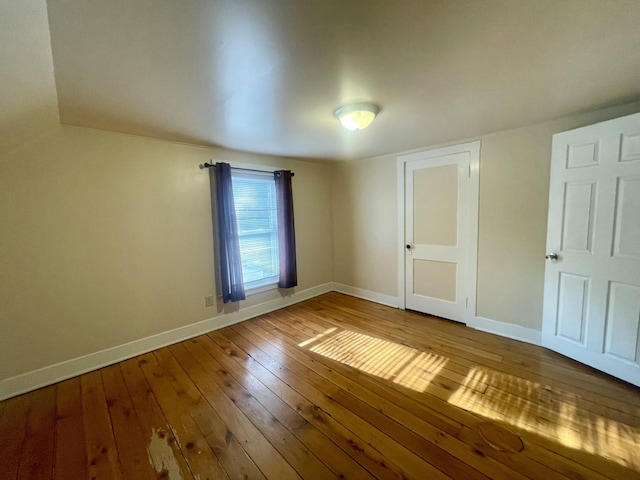 408 Wilkinson St, Chelsea, MI 48118 - unfurnished bedroom featuring hardwood / wood-style floors and baseboards