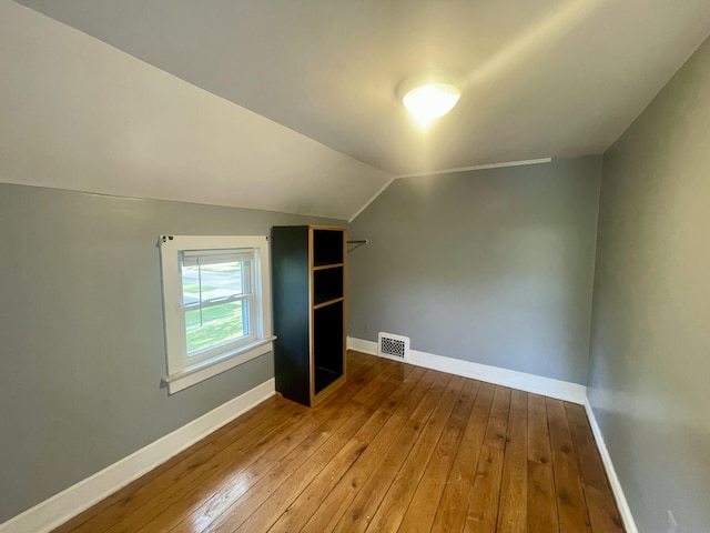 408 Wilkinson St, Chelsea, MI 48118 - bonus room with wood-type flooring and vaulted ceiling