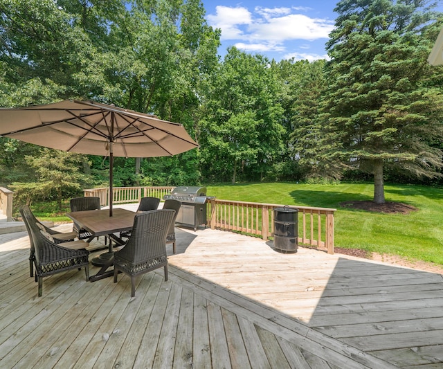 7624 Quail Ridge Dr, Dexter, MI 48130 - wooden terrace featuring a lawn, outdoor dining area, a grill, and view of scattered trees
