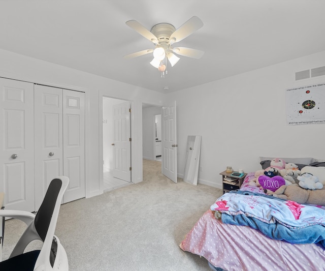 7624 Quail Ridge Dr, Dexter, MI 48130 - bedroom featuring light colored carpet, a closet, and a ceiling fan