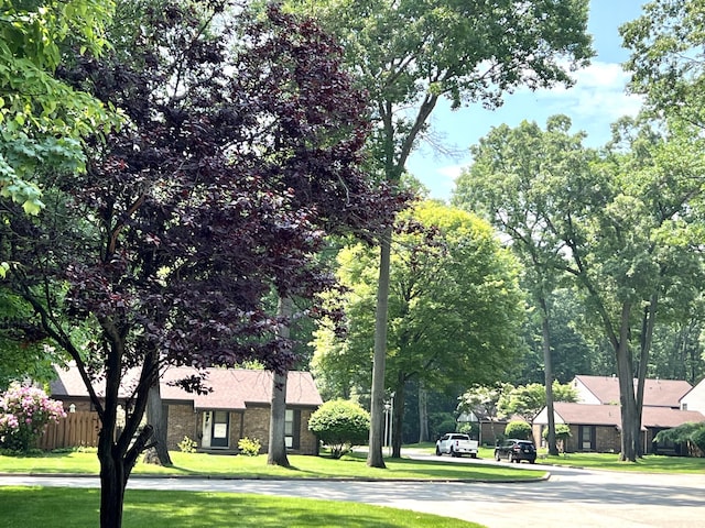 3676 Brentwood St Unit 30, Norton Shores, MI 49441 - view of front facade featuring stone siding