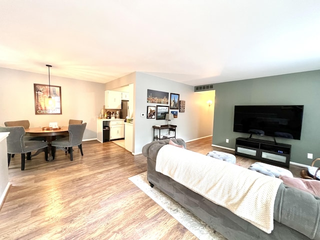 3676 Brentwood St Unit 30, Norton Shores, MI 49441 - living room featuring light wood-type flooring and baseboards